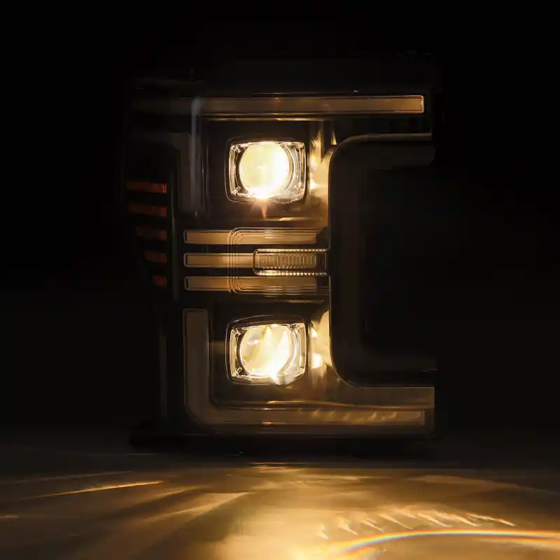 AlphaRex 17-19 Ford F-250/350/450/550 Super Duty PRO-Series Proj Headlights Black w/SeqSig & DRL Time-Limited